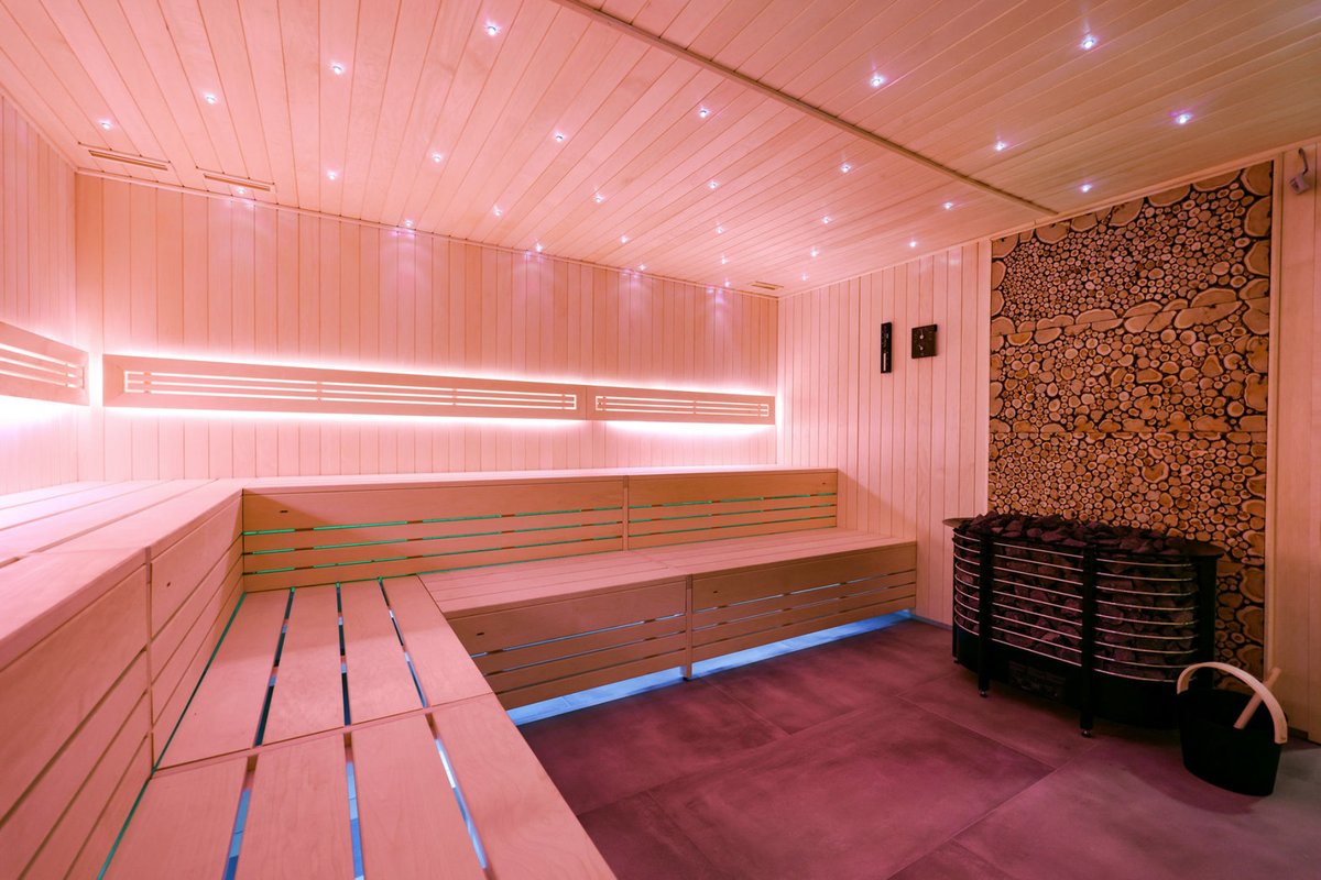Sauna interior with wood-log feature wall